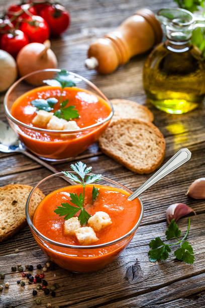 istock Spanish gazpacho in glass bowls on rustic wooden table 1153436622