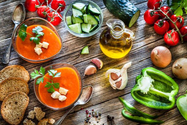 istock Spanish gazpacho and ingredients on rustic wooden table 1153436630