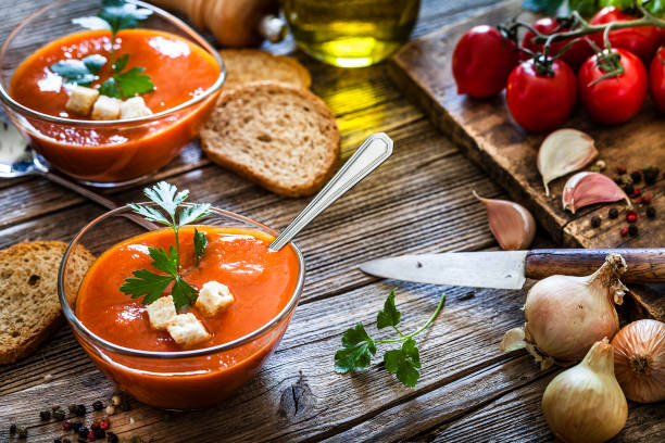istock Spanish gazpacho in glass bowls on rustic wooden table 1153436649