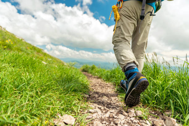 istock Hiking boots on the mountain trail 1153438593