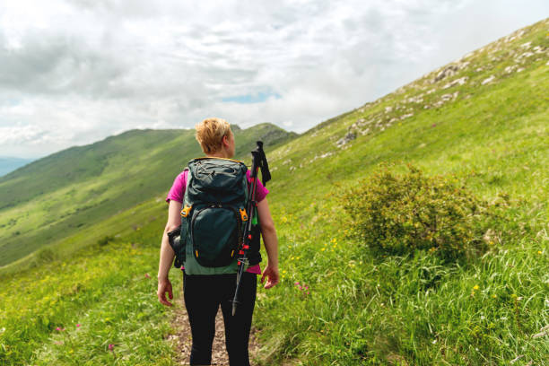istock Female hiker preparing to hike the mountain 1153438746