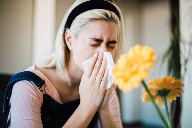 istock Girl blowing nose 1153440431