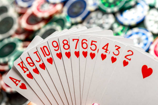 istock Cards and chips for poker on green table 1153440647