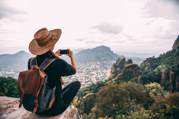 istock Tourist woman making a photo. 1153441989
