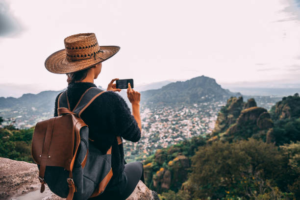 istock Tourist woman making a photo. 1153442012