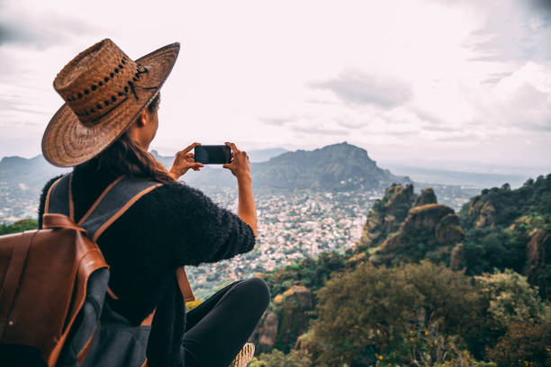 istock Tourist woman making a photo. 1153442025