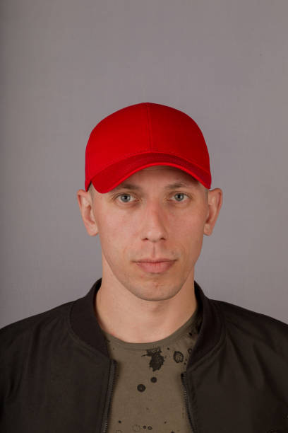 istock Handsome young man in a headdress on a gray background 1153442327