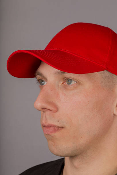 istock Handsome young man in a headdress on a gray background 1153442367