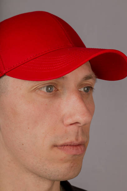 istock Handsome young man in a headdress on a gray background 1153442471