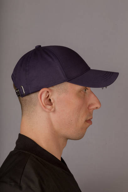 istock Handsome young man in a headdress on a gray background 1153445721