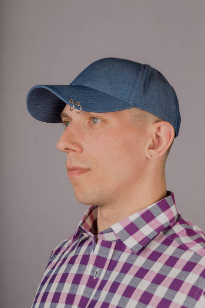 istock Handsome young man in a headdress on a gray background 1153446074