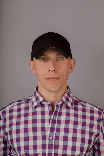 istock Handsome young man in a headdress on a gray background 1153446861