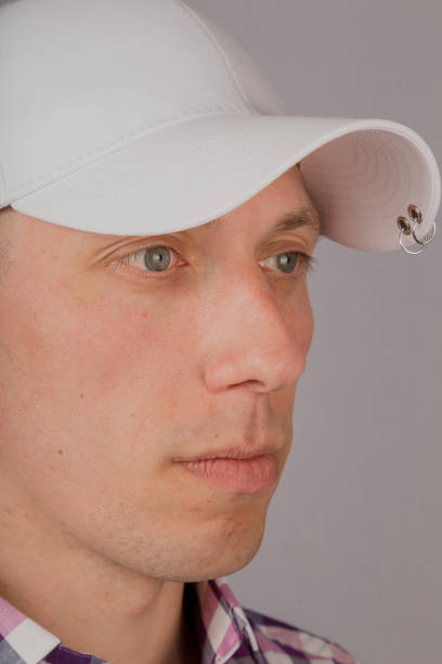 istock Handsome young man in a headdress on a gray background 1153447354