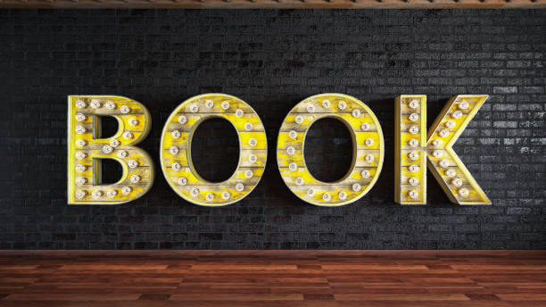 istock Book Light Bulb Sign on Black Brick Wall 1153447395