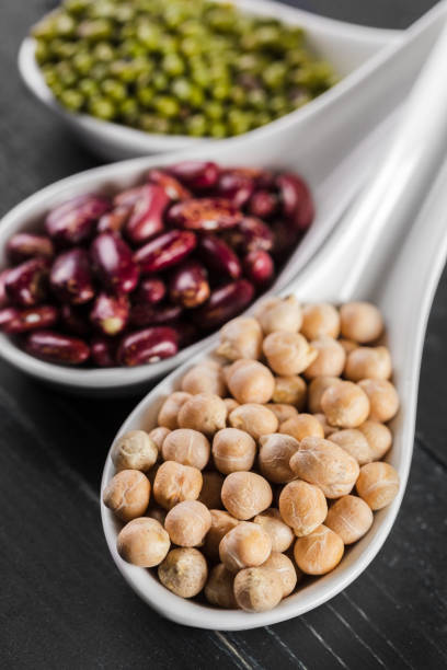 mix of beans on wooden table