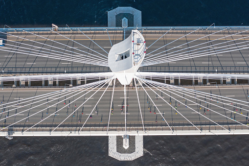 Cable-stayed bridge across the mouth of the river, aerial view from the top of the bridge support