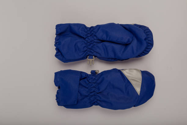 istock Children's winter gloves on a white background 1153450168
