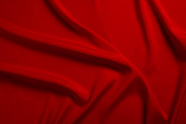 istock Red silk or satin luxury fabric texture can use as abstract background. Top view. 1153450365