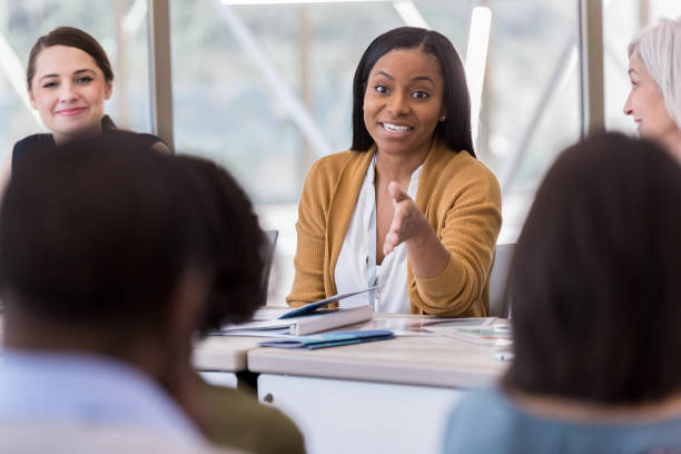 istock Mid adult female panelist makes emphatic point 1153450877