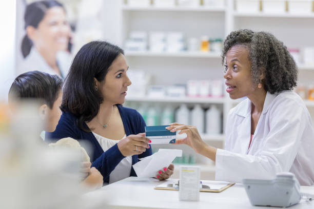 istock Attentive pharmacy customer talking with pharmacist 1153450969