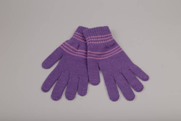 istock Children's winter gloves on a white background 1153450972