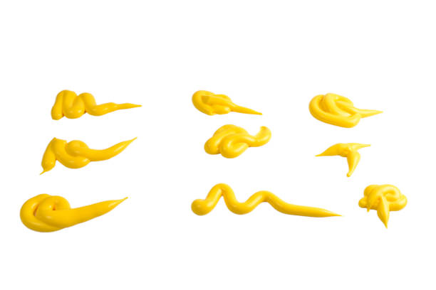 istock Yellow sauce splashes isolated on white background. 1153450985