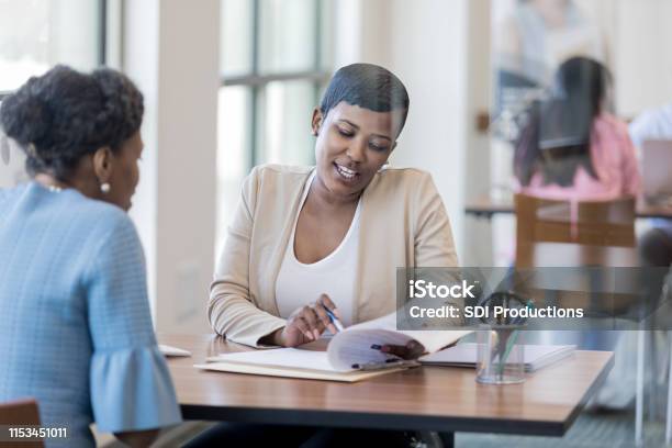 Mid Adult Loan Officer With Customer Stock Photo - Download Image Now - Credit Union, Bank Manager, Financial Loan