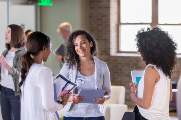 istock Attentive homeowner association representative talking with female neighbors 1153451609