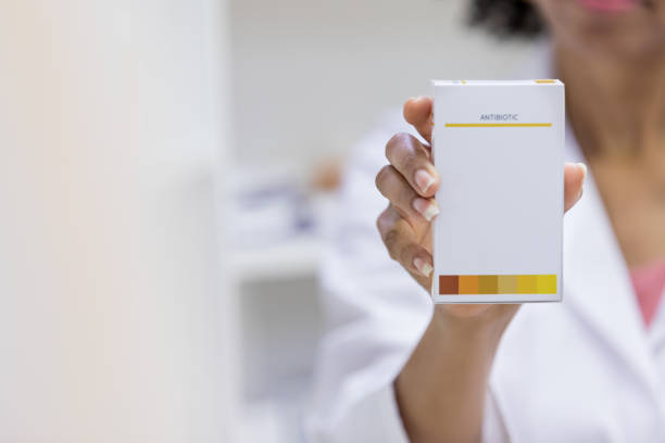 istock Doctor holds new medication in an advertisement 1153451666