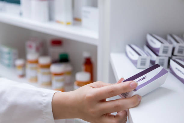 istock Closeup of pharmacist selecting ointment from stock 1153451672