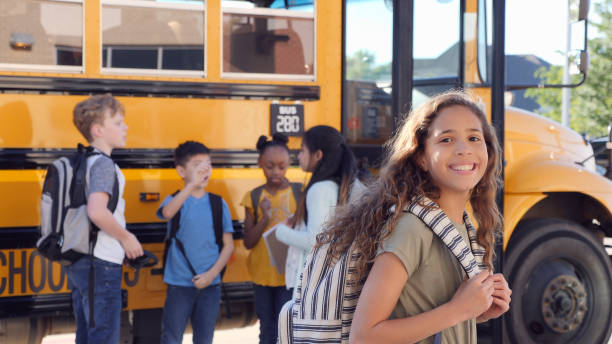 istock Junior high schoolgirl smiles proudly at camera 1153451725