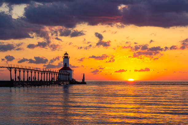 istock Dramatic Sunset at Michigan City East Pierhead Lighthouse 1153452671