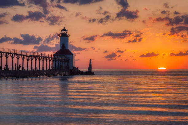 istock Dramatic Sunset at Michigan City East Pierhead Lighthouse 1153452701