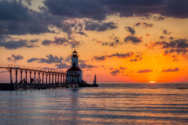istock Dramatic Sunset at Michigan City East Pierhead Lighthouse 1153452786