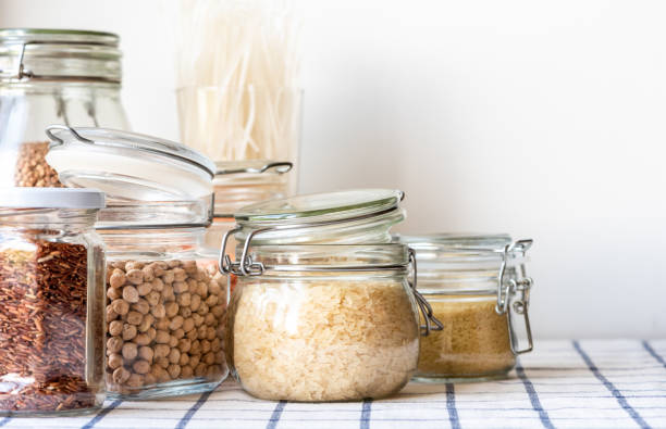 istock Various raw grain, cereals and legumes in glass jars 1153452885