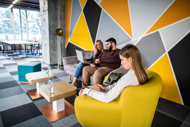 istock Business people sitting in waiting area 1153453831