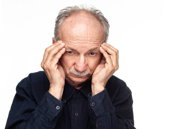 istock Elderly man suffers from headache 1153454794