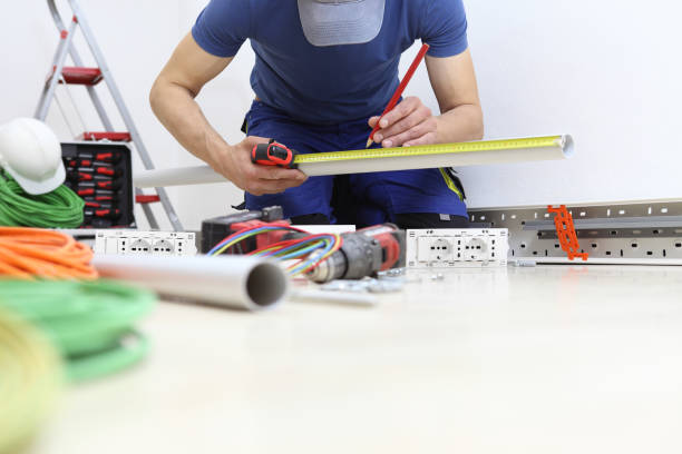 istock electrician at work with meter and pencil in hands measures the plastic pipe to pass the electric cables to the sockets, install electric circuits, electrical wiring 1153456090