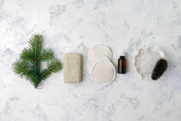 istock Spa treatment on light background. Spa accessories composition on white table. Natural aroma oil, sea salt, sisal, natural soap. Healthy skin care. SPA, zero waste concept 1153456843