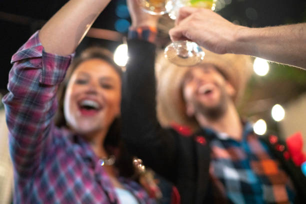 istock Friends making a toast during a camp, junina party 1153456873