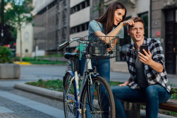 istock Couple pushing bicycles and walking 1153457026