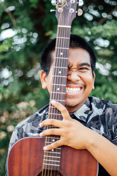 istock Happy Farmer Playing Guitar 1153460395
