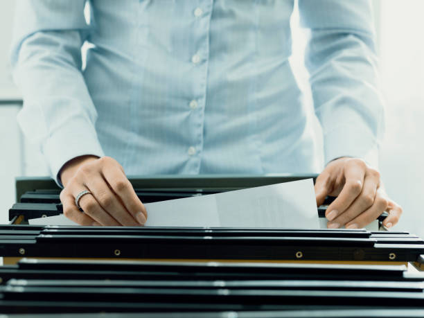 istock Office worker searching files in the archive 1153460535