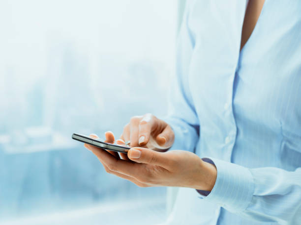 istock Corporate business executive connecting with a smartphone 1153461343