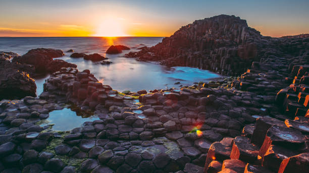 istock Sunset, Giants Causeway, Northern Ireland 1153461419