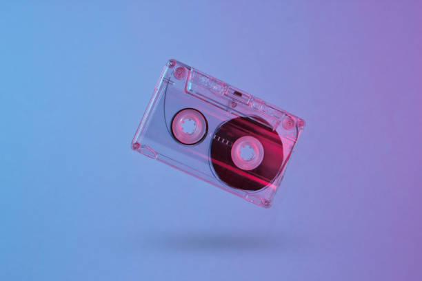 istock Minimalism retro style concept. 80s. Audio cassette in neon red blue light. Retro wave 1153461859