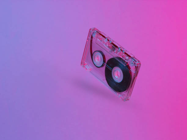 istock Minimalism retro style concept. 80s. Audio cassette in neon red blue light. Retro wave 1153461920