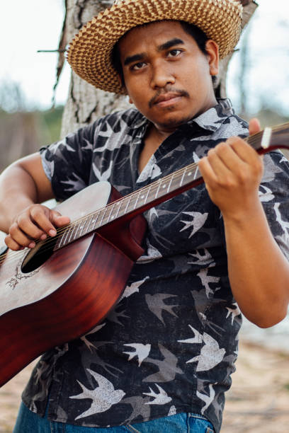 istock Happy Farmer Playing Guitar 1153461956