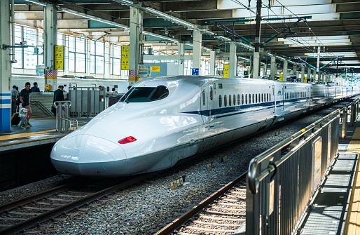 Hiroshima, Japan - March 27, 2019: Shinkansen - japanese bullet train - departing from the railway station in Hiroshima.