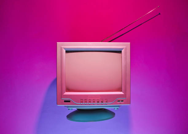 Retro wave, 80s concept. Old tv with antenna, neon light. Night television. Top view, flat lay stock photo